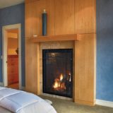 Tall fireplace in bedroom