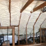Spray foam insulation in an interior wall and ceiling.