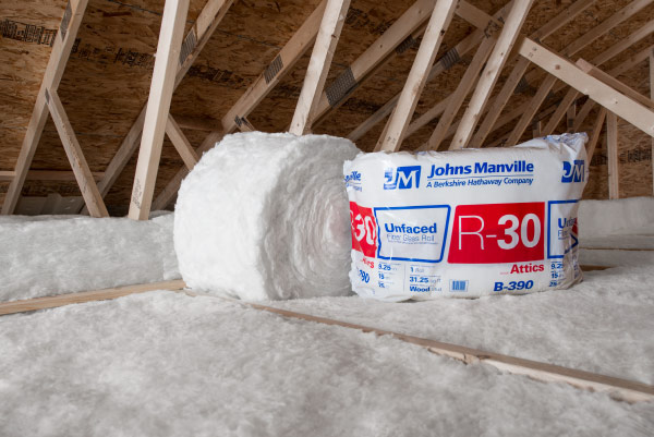 Fiberglass batt roll insulation on the floor of an attic.